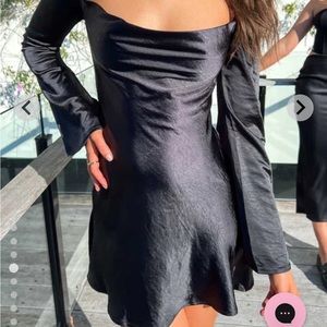 Beginning Boutique “Marriene Black Mini Dress” long sleeve, open back.